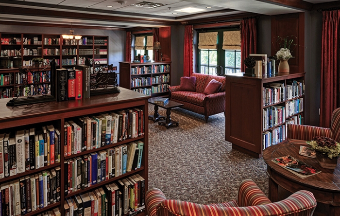 Cozy library with bookshelves and seating