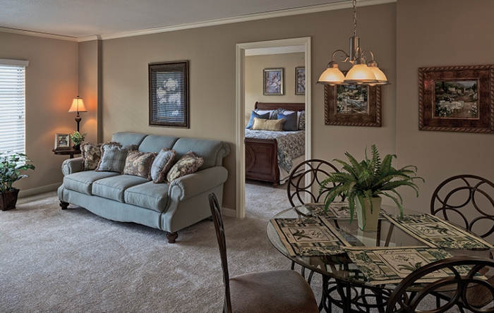 Cozy living area of a resident unit with furniture.
