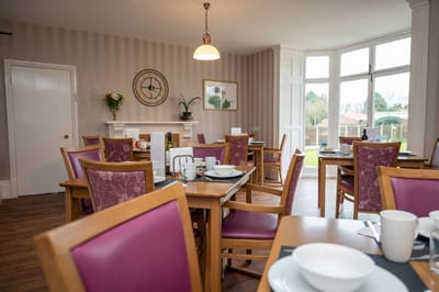 Interior dining room filled with tables and chairs
