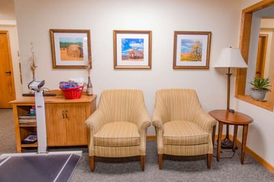 Cozy common area with chairs and artwork
