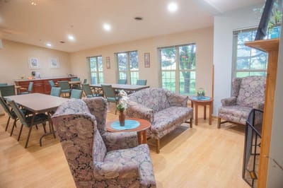 Common area with seating arrangements and large windows