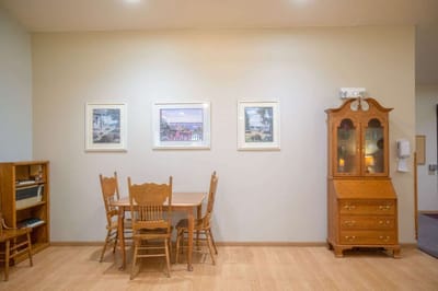Cozy dining area with wood furniture and artwork