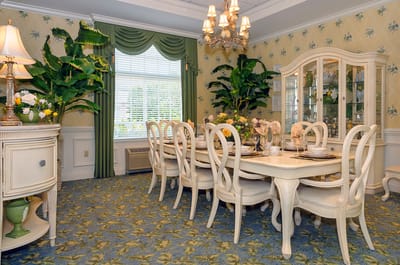 Elegant dining room with decorative plants and table settings