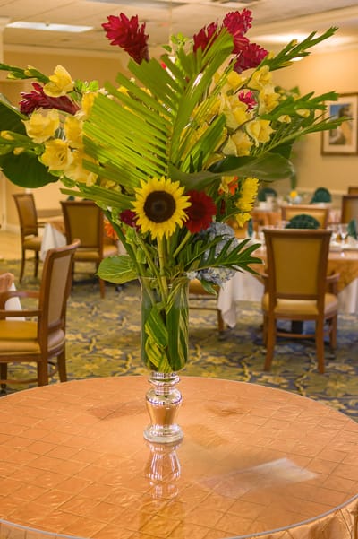 Flower arrangement on a dining table in the facility's dining room