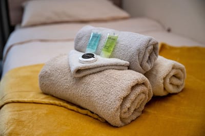 Lound Hall Nursing Home, nursing home — Stacked towels and toiletries on a bed