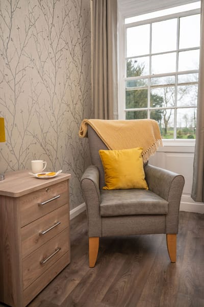 Cozy private room with a chair and decorative elements