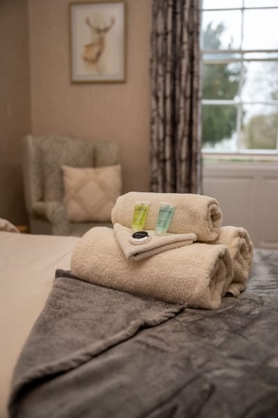 Lound Hall Nursing Home, nursing home — Neatly arranged towels and toiletries on a bed