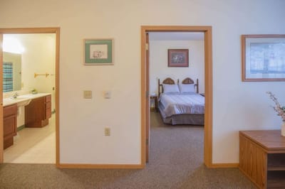 Interior view of a resident room with bedroom and bathroom
