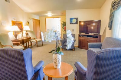 Bright common area with comfortable seating and decor