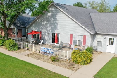 Exterior view of a facility with outdoor seating area