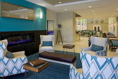 Modern common area with seating and fireplace