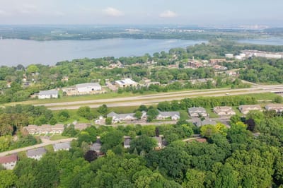 Aerial view of an assisted living community surrounded by greenery
