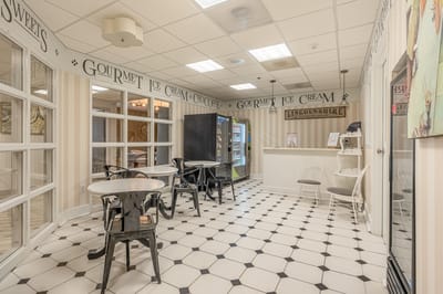 Interior view of an ice cream area with seating