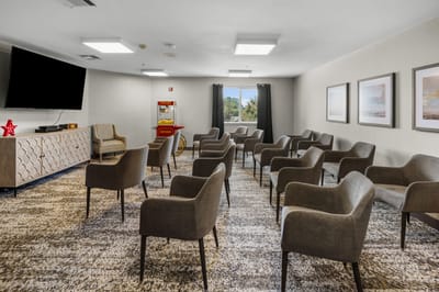 Interior common area with seating and TV