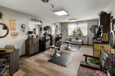 Bright salon area with styling chairs and mirrors