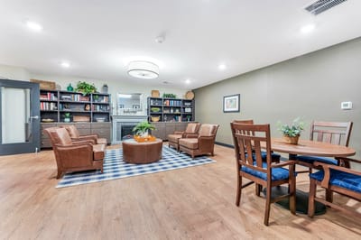 Common area with seating and bookshelf decor