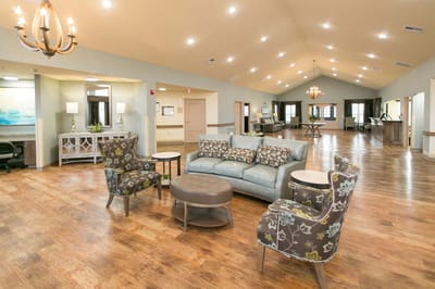 Bright common area with seating and wood flooring
