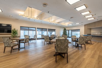 Bright common area with tables and chairs