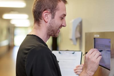 Staff member working in a corridor