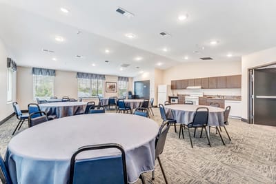 Interior view of a common area with tables and chairs