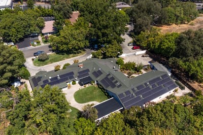 Aerial view of the assisted living facility surrounded by greenery