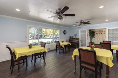Dining area with bright tables and chairs