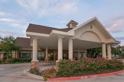 Exterior view of the facility entrance with landscaping