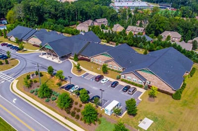 Aerial view of the facility buildings and parking lot