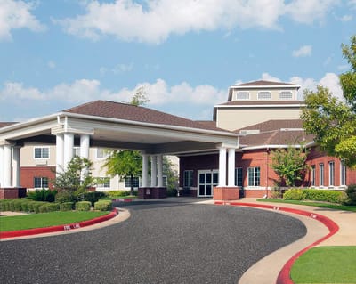 Exterior view of Azalea Estates of Gonzales building