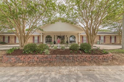 Front exterior of Azalea Estates of Monroe with landscaping