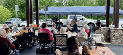 Residents enjoying a live music performance outdoors