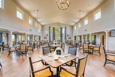 Bright dining room with tables set for meals