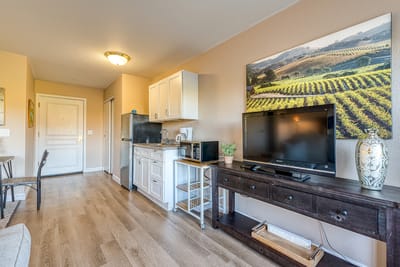 Bright interior of a resident room with kitchenette
