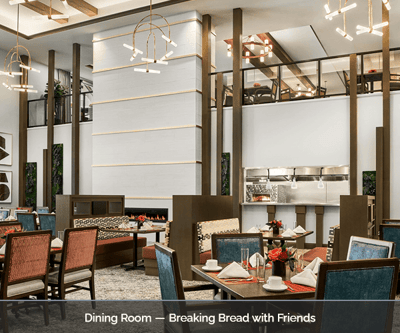 Elegant dining room with tables set for residents