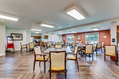Bright dining area with wooden tables and chairs