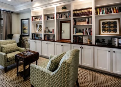 Cozy common area with bookshelves and seating