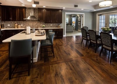 Bright common area with dining space and kitchen