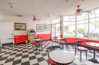Bright dining area with retro decor and tables