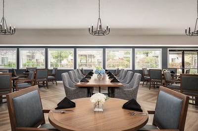 Elegant dining room with tables set for a meal