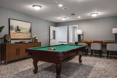 Interior view of a common area with a pool table