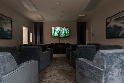 Common area with comfortable seating and a TV