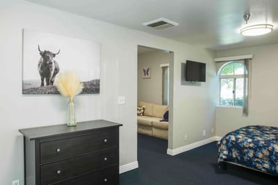 Interior view of a resident room with a bed and decor