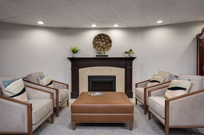 Cozy sitting area with comfortable chairs and fireplace