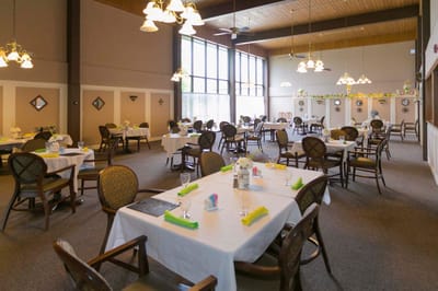 Bright, spacious dining area with table settings