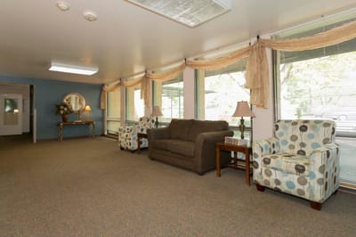 Interior lounge area with seating and windows