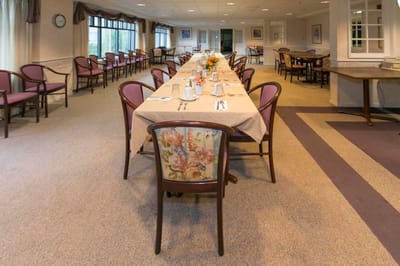 Dining room with tables set for a meal