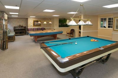Interior recreational area with billiard tables