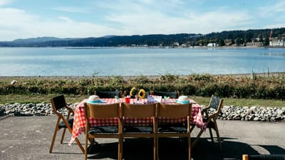 Outdoor dining setup by the water