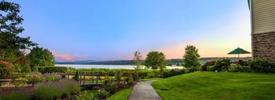 Scenic outdoor view of landscaped grounds by the lake