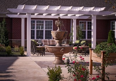 Outdoor patio area with fountain and seating